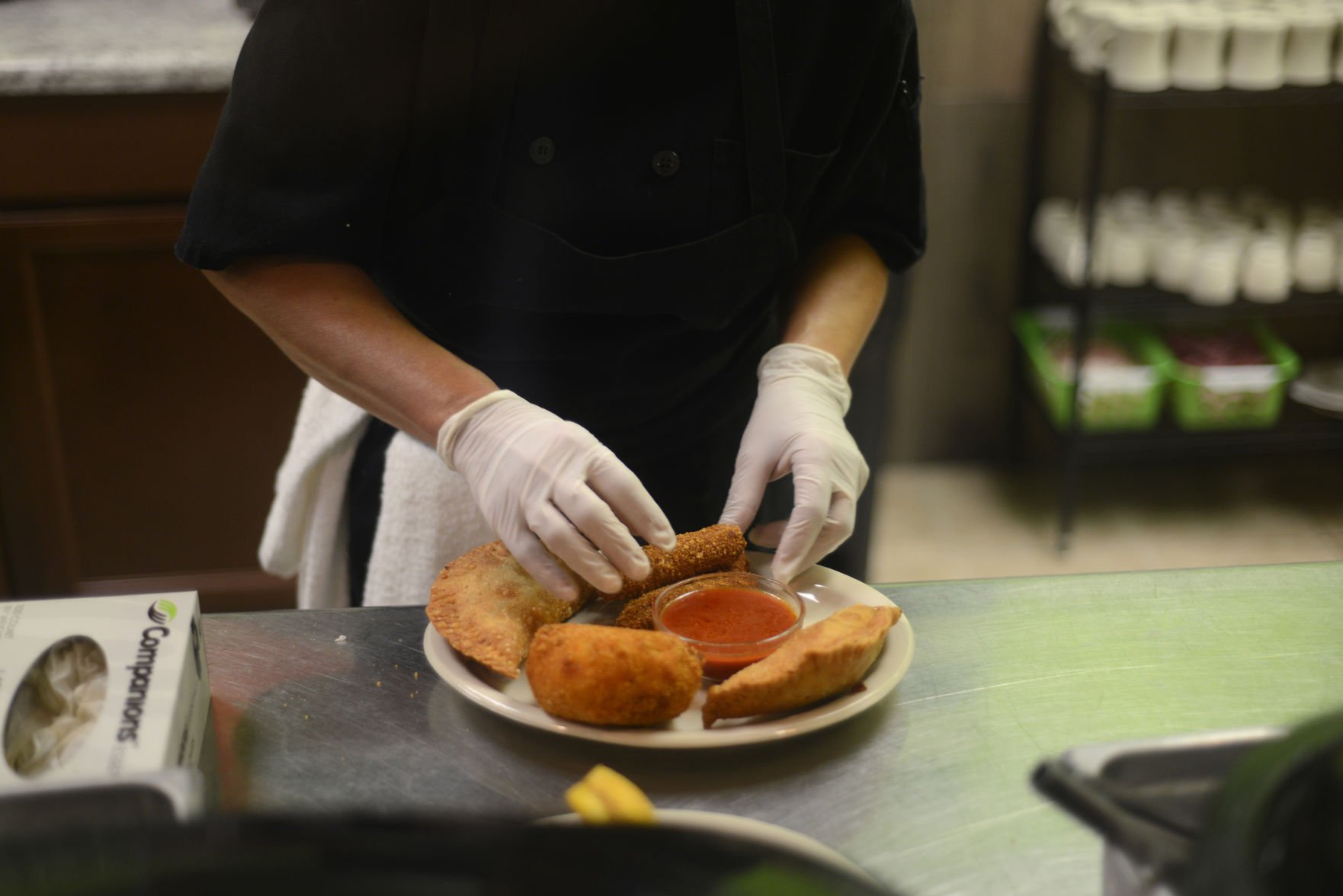 Katy Ugalde prepares a Combination Platter